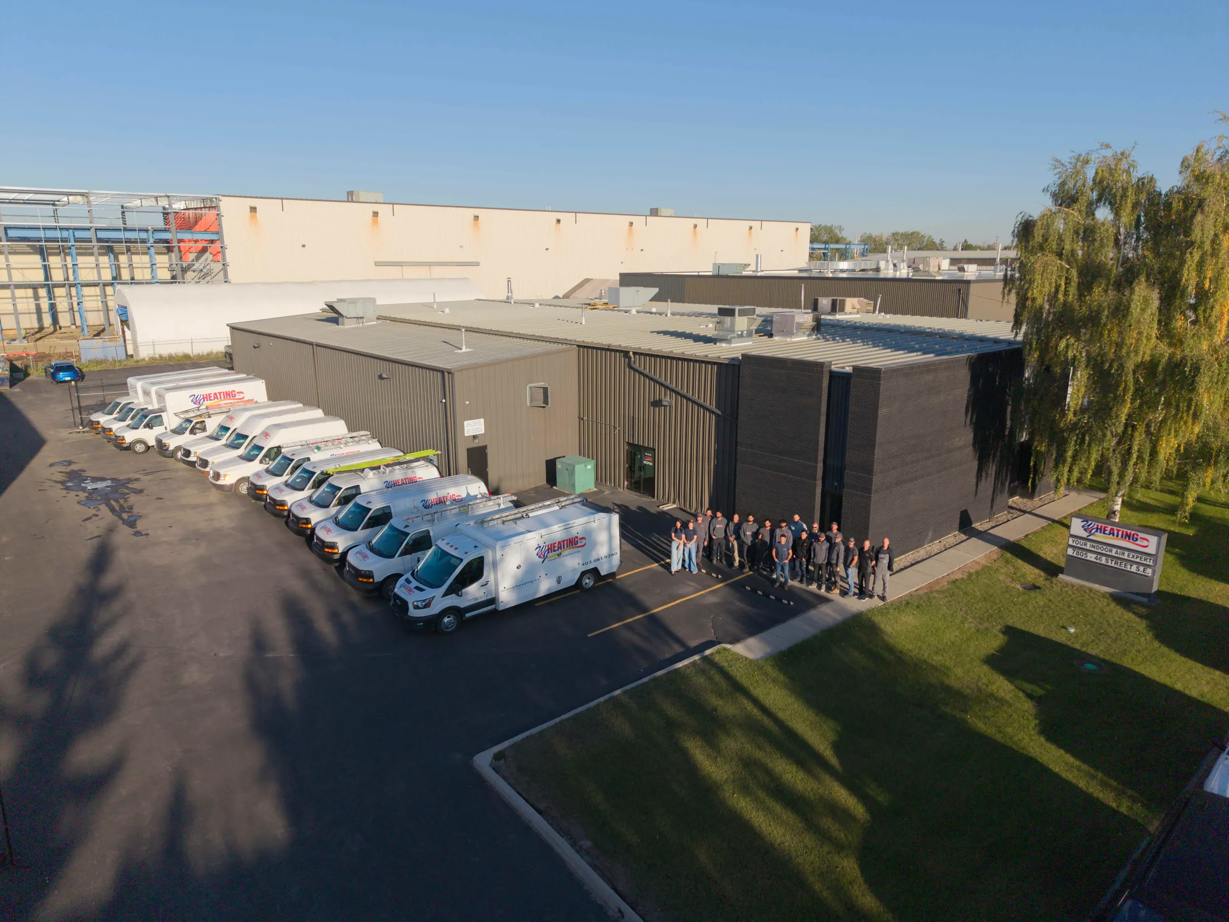 Aerial view of the W & J Heating facility, service fleet, and team in Calgary